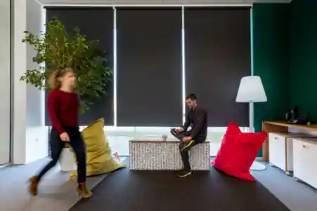 man and woman taking a break in a modern workspace