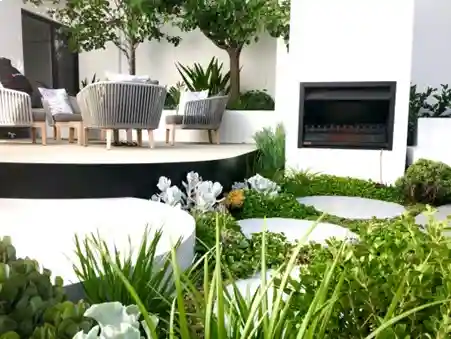 outdoor patio with grey chairs and trees