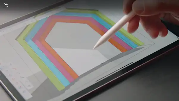 mans hand using SKU ipad and apple pencil to draw a colourful tunnel