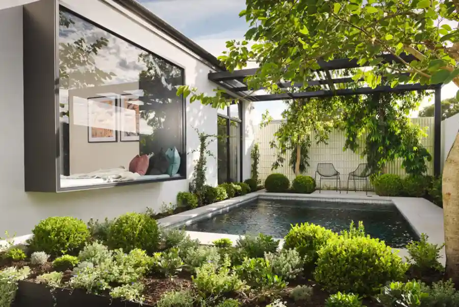 modern pool/ outdoor area with book nook and greenery
