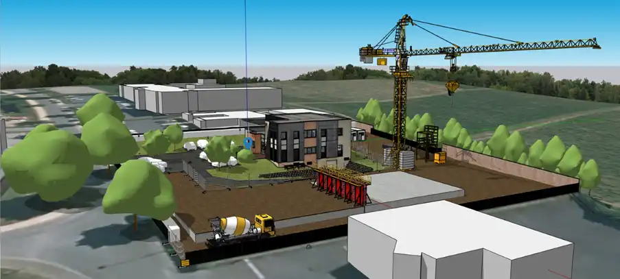 model showing construction equipment and foundation being laid for new building