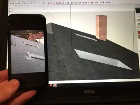 man showing the before design of roof and the after